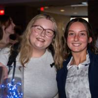 Two grads smile at Toast